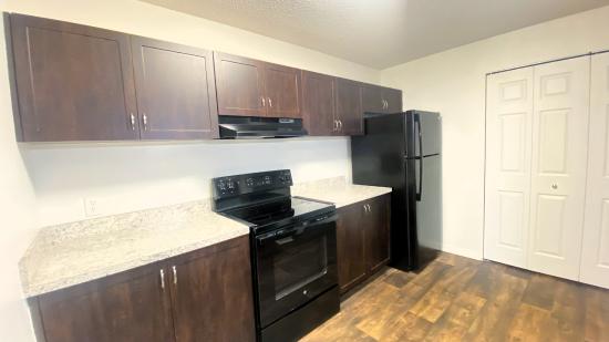 #7  Two Bedroom Two Bath Available Now 12/1/2023 
Kitchen Picture.  Refrigerator has ice maker and Washer and Dryer connections. - The Harbor